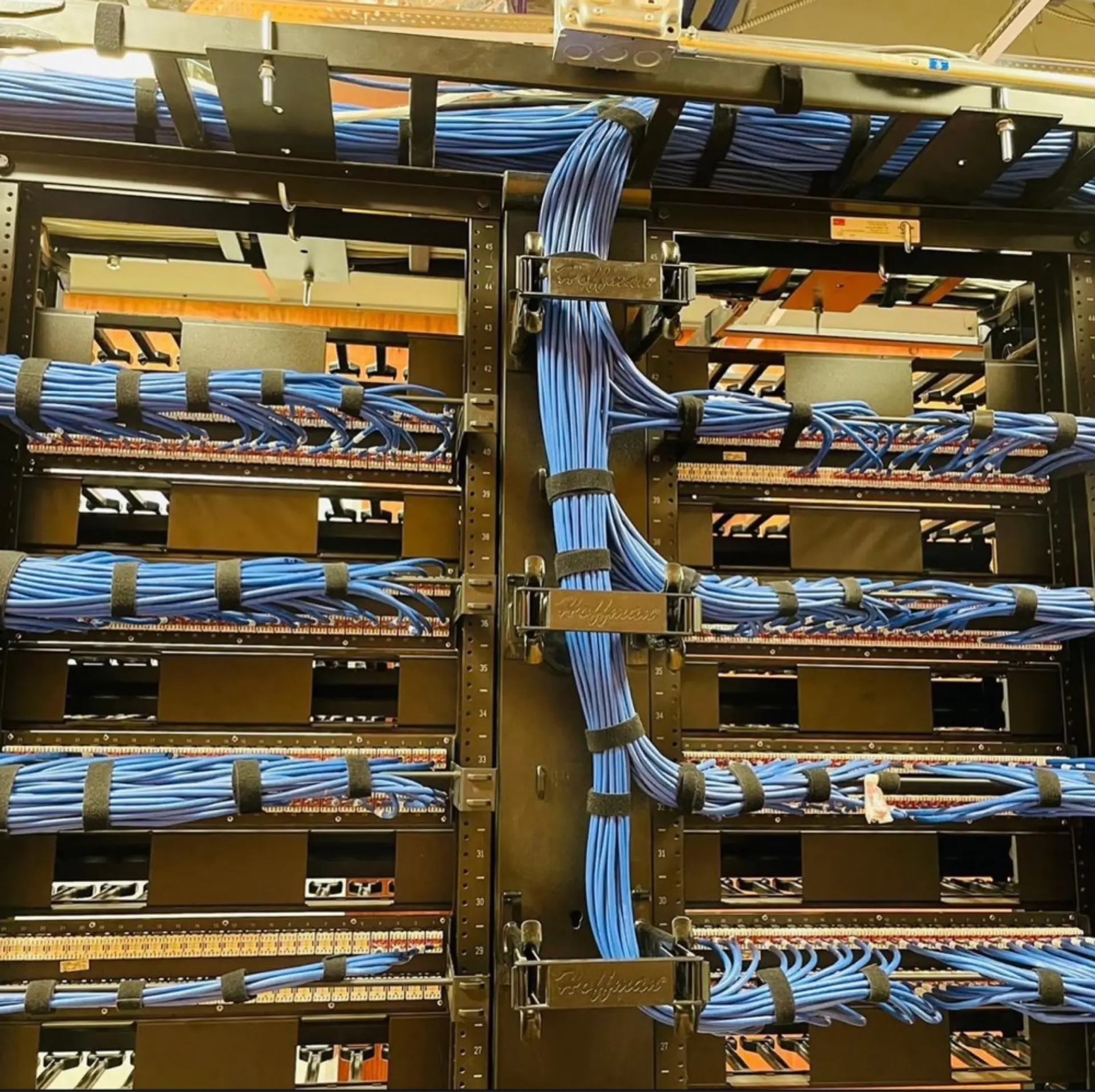 Clean and organized server rack installation with optimized network hardware for high-performance connectivity in a Houston office.